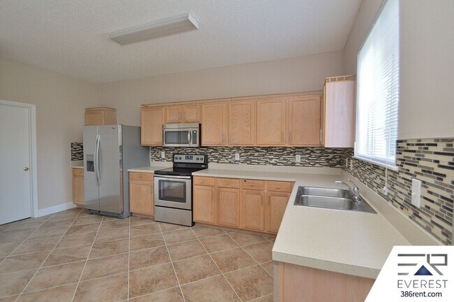Building Photo - SPACIOUS, FULLY FENCED 4/2.5/2 IN DESIRABLE MATANZAS WOODS