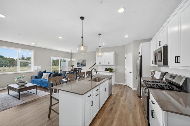 Building Photo - Westview townhome plan in Corcoran’s Hope Meadows community—a brand-new townhome development near...