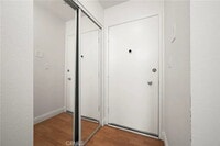 Building Photo - "Chic 1-Bed Retreat with Pool & Central Vacuum in Anaheim's Heart – 710 Sq Ft of Hardwood Elegance!"