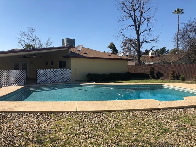 Building Photo - 3 bd, 2 ba, with in-ground pool & covered RV parking