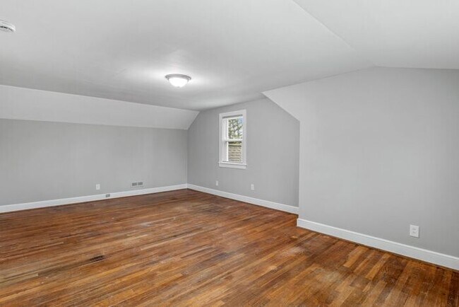 Building Photo - Brick home, Two Story, Hardwoods, DR, 2 Sun Rooms, FP, Carport!.