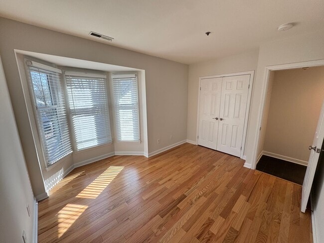 Building Photo - Top-Floor End Unit Condo at New Bern Place