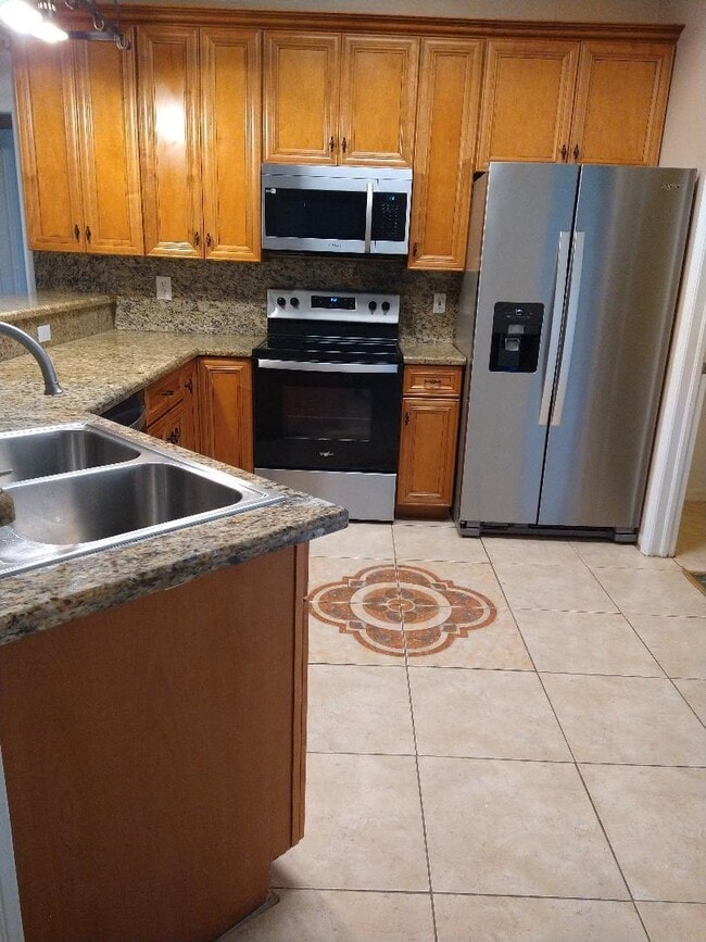 Building Photo - 6444 NW Hacienda Ct