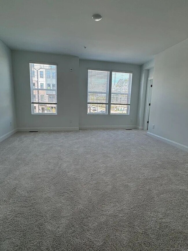 Building Photo - Stunning New Construction 3BD, 2.5BA Cary Townhome-Style Condo with a 1-Car Garage in a Prime Loc...