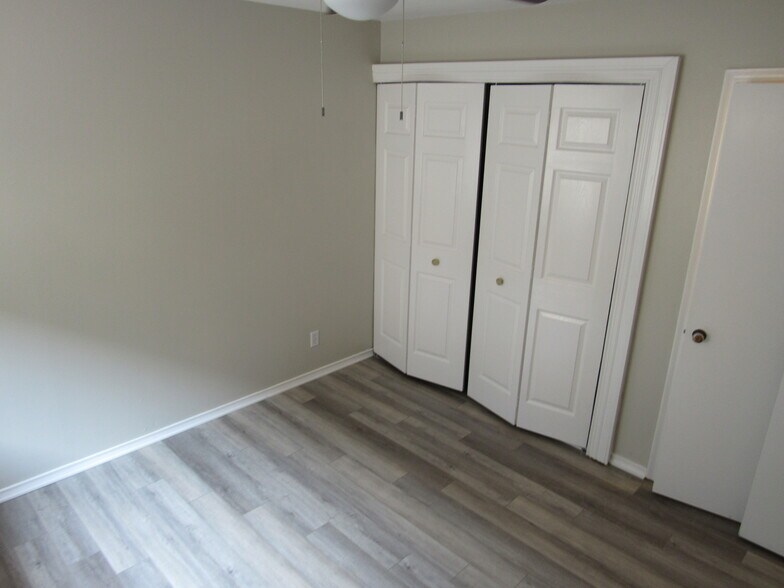 Bedroom #1 with washer/dryer hookups in closet - 6205 Oram St
