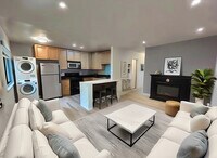Living room looking to Kitchen, shown with optional fireplace. AI generated furniture - 1623 Alcatraz Ave