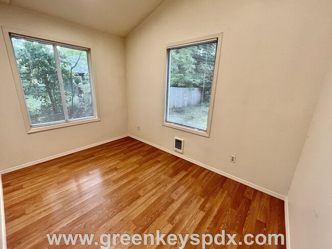Building Photo - This 3-bedroom 1-bathroom house has a large front yard and a mostly fenced backyard.