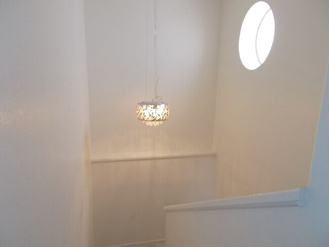 Building Photo - Two-story, 2-bedroom townhome ideally located in the heart of Boulder City