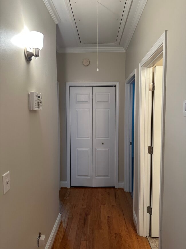 Hallway with bathroom on right, linen closet at the end of the hallway with bedrooms adjacent - 3406 Margrave Rd