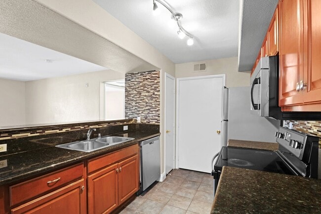 Building Photo - SE!!! Gated!! 1 Bedroom 1st Floor!! One Car Garage!!! Community Pool, Spa, Clubhouse!!! All tile ...
