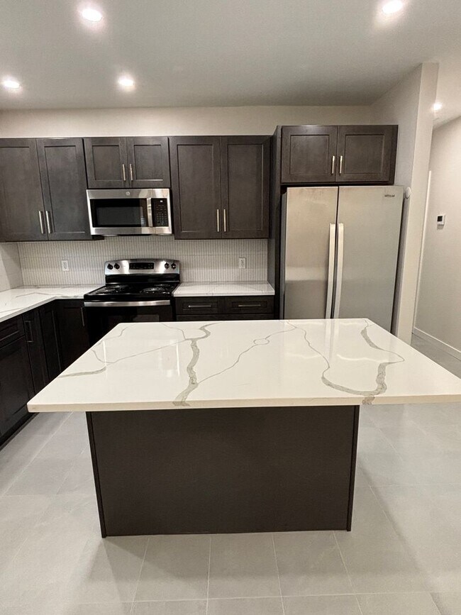 Building Photo - A MUST SEE THREE BEDROOM DUPLEX