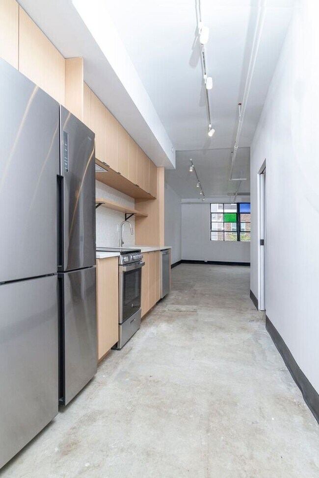 Building Photo - Check out this studio ! We want you to cal...