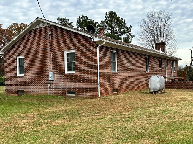 Building Photo - 4-Bedroom Brick Home with Full Unfinished ...