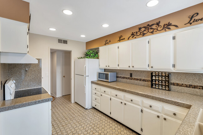 New, black GE side-by-side refrigerator with water & ice dispensers not shown in photo - 10113 W Pebble Beach Dr