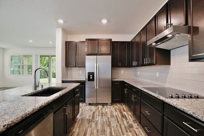 Building Photo - Gorgeous 4/3 Spacious Home with a 2 Car Garage Located on a Conservation Lot in Creekstone Neighb...