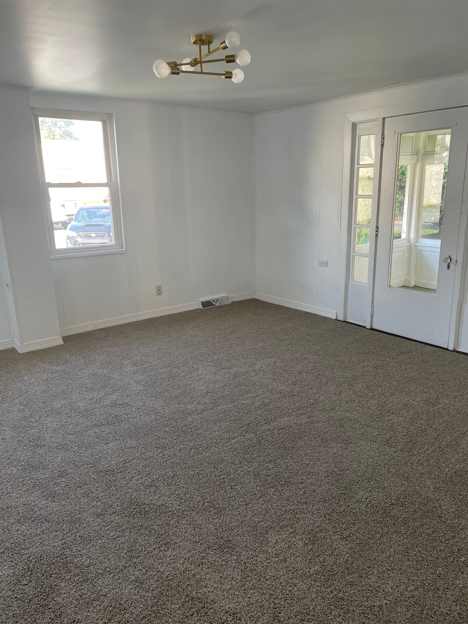 Living room. New carpet, paint and light fixture. - 106 Water St