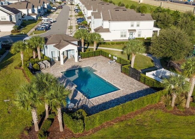Building Photo - Immaculate Townhome · Dual En-Suite Bedrooms + Flex Loft · Cable & Internet Included · 3.5 Miles ...