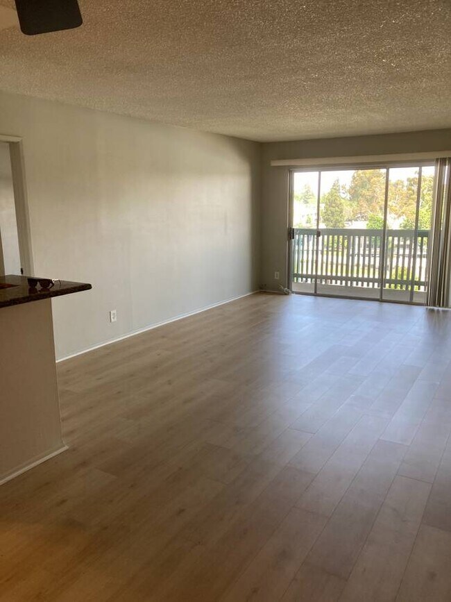 Living Room with Balcony - 448 N Bellflower Blvd