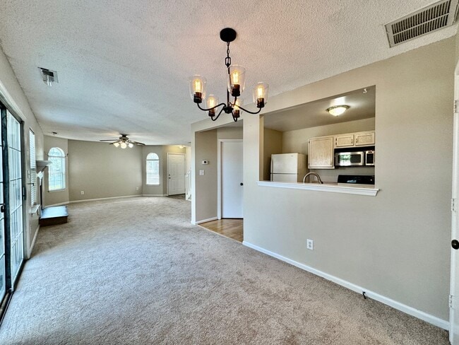 Building Photo - Available 06-15-25! End-Unit Condo w/2 Pri...