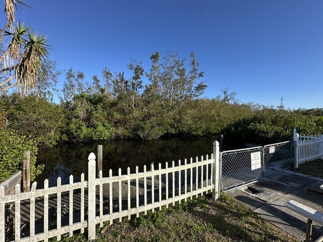 Building Photo - "Charming Waterfront Condo Retreat: Fully ...