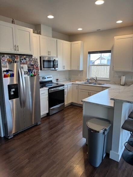 Kitchen with Dishwasher, Stove, and Microwave - 205 Manhattan South Rd