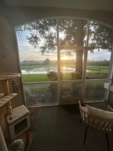Screened patio with lake view - 7123 Yacht Basin Ave