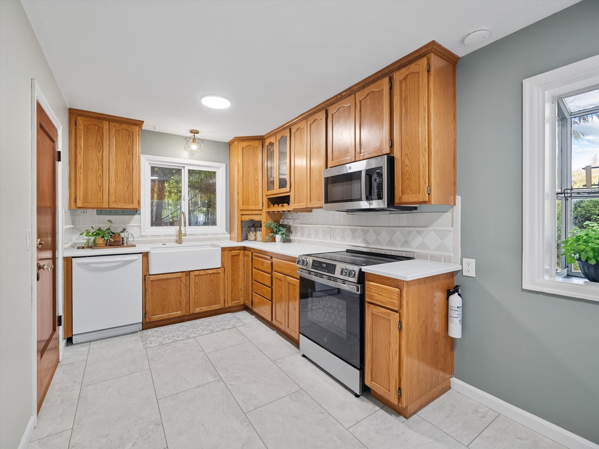 The spacious kitchen has brand new countertops. - 9835 SW 80th Ave