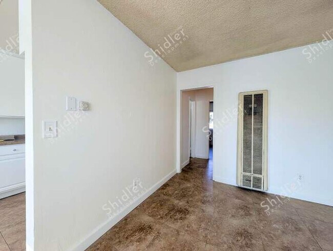 Building Photo - Upstairs 2 Bedroom 1 Bath with Massive Walk In Closet, Covered Gated Parking