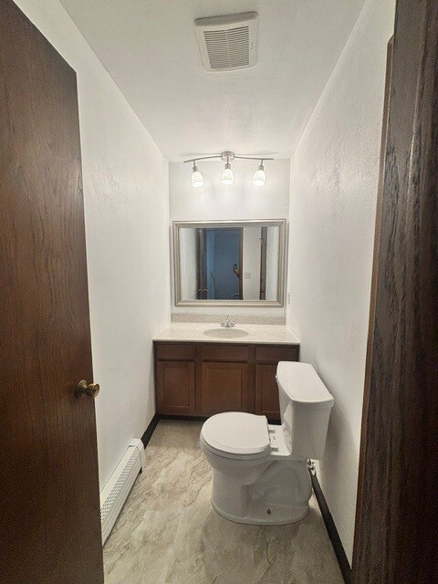 Ensuite half bath off of primary bedroom - 1044 W 10th Ave