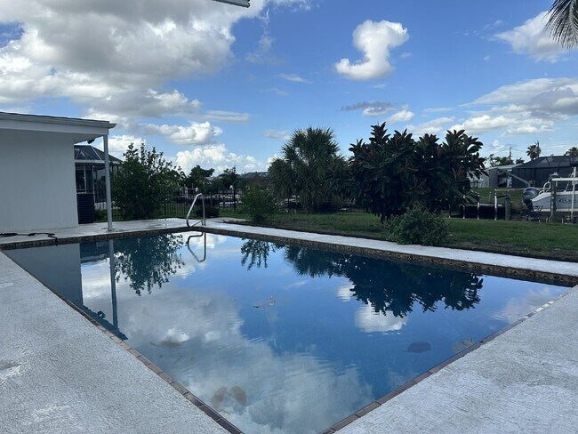 Building Photo - "Elegant 3-Bed Waterfront pool Home"