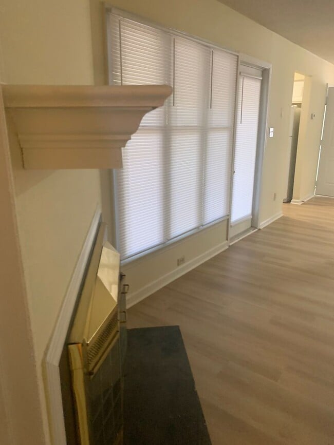 Building Photo - ONE LEVEL CONDO NEAR REX HOSPITAL -Firepla...