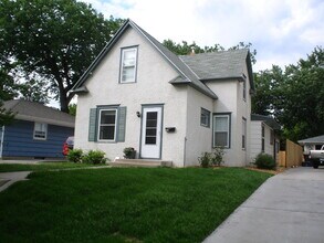 Building Photo - Charming 4-Bedroom Minneapolis Home with Finished Basement & Hardwood Floors