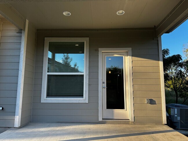 Building Photo - For Lease – Modern 2023 Condo Backing to Greenbelt | Creekside at Pioneer Crossing West