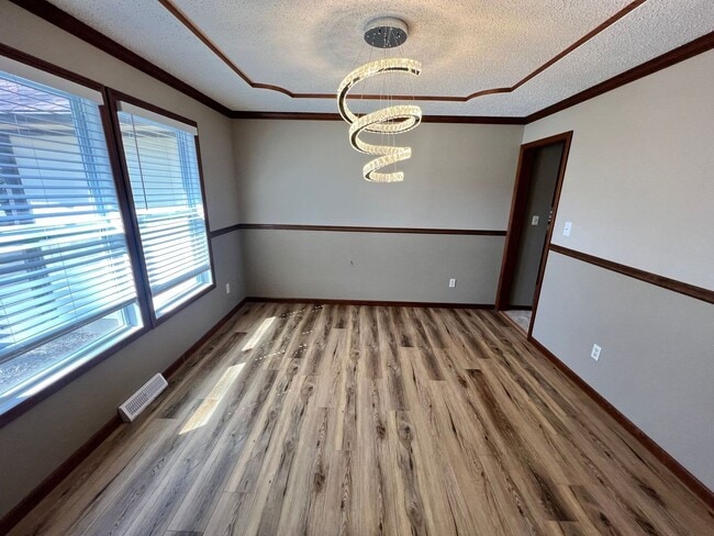 Building Photo - Spacious 3BR Home with 3-Car Garage & Big Backyard