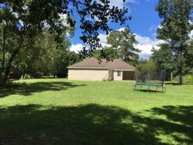 Building Photo - Spacious 3BR Brick Home with Open Split Floor Plan & Tiled Back Porch on Nearly an Acre