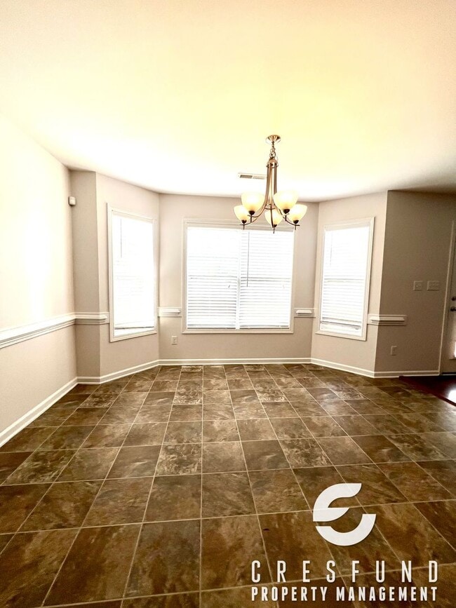 Building Photo - Freshly Painted and Spacious 4 Bedroom, 3 ...