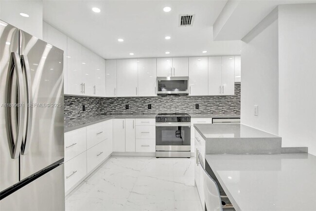 Building Photo - 9801 Collins Ave