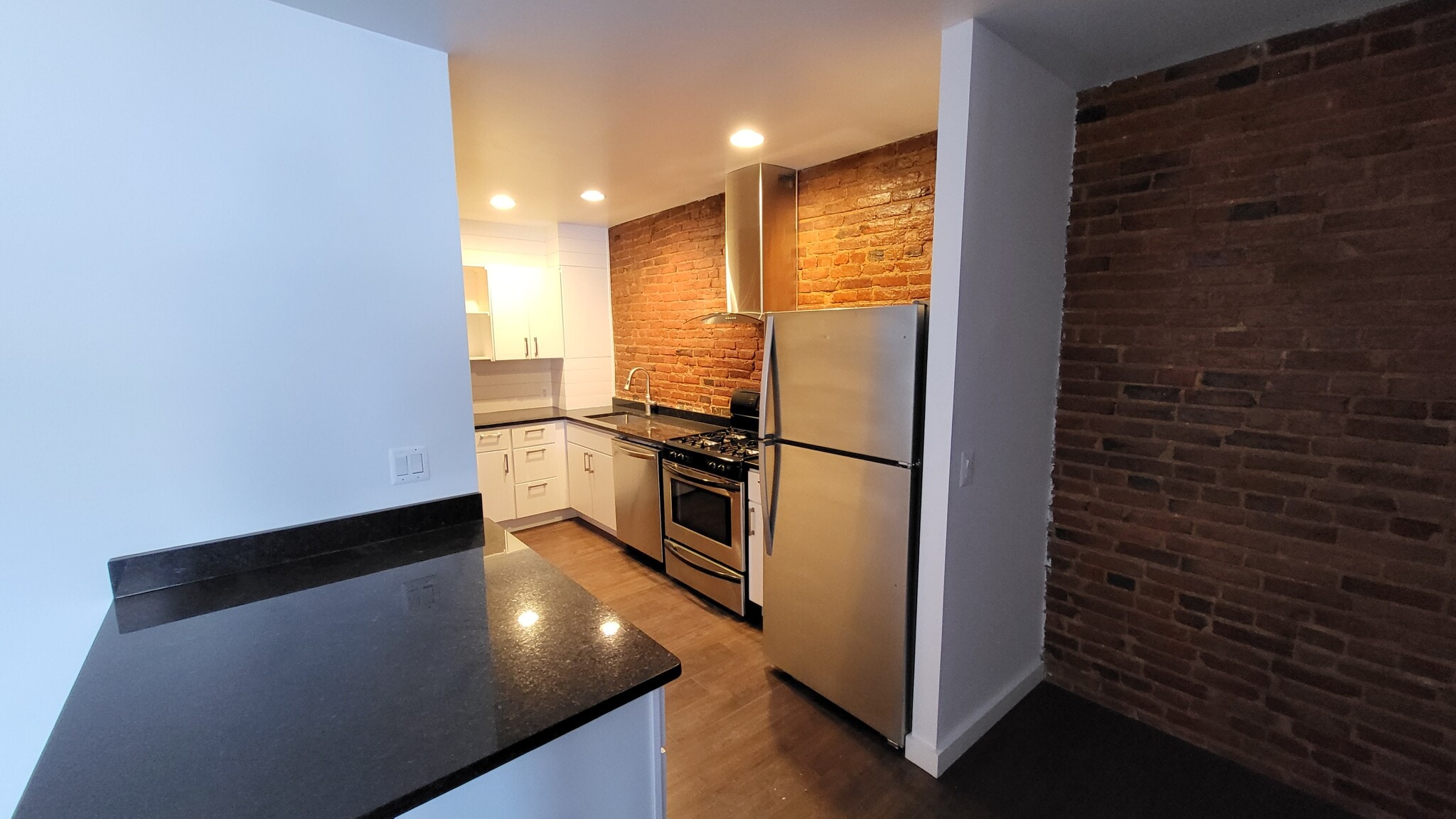 Great exposed brick throughout! - 403 N Charles St