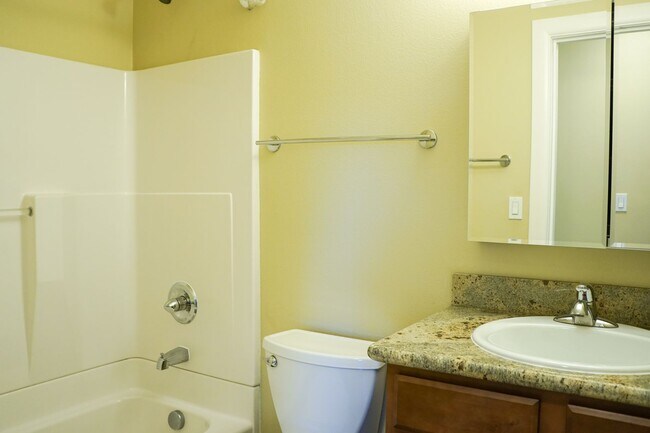 Building Photo - Top-Floor 2-Bedroom with Bamboo Flooring + Off-Street Parking!