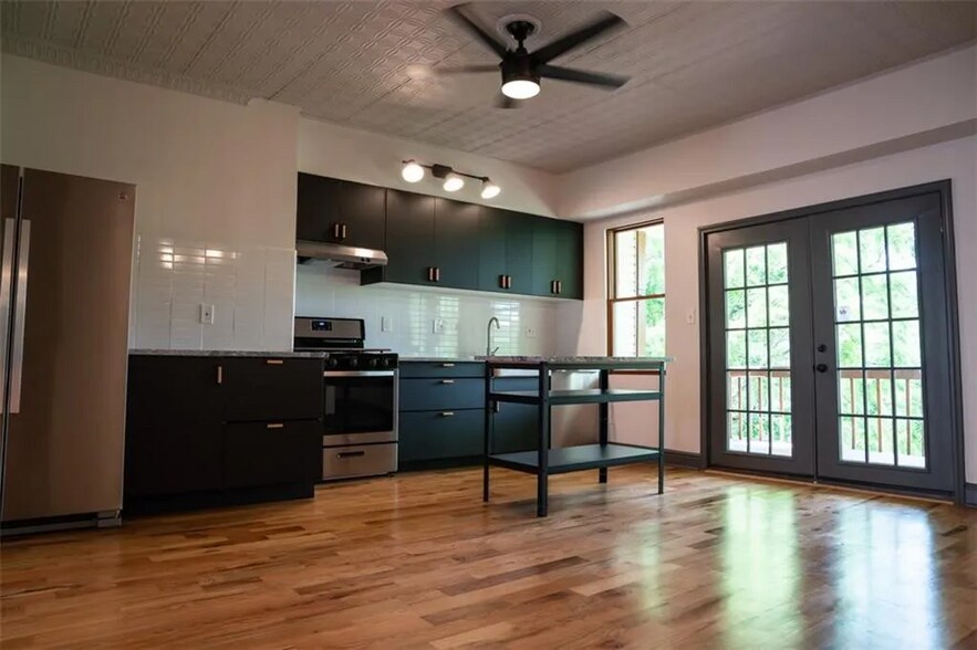 Kitchen and french doors to upper porch and view of Spring Hill - 1120 Brabec St