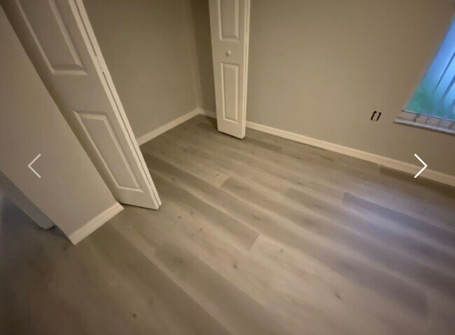 Building Photo - Available NOW! NEW FLOORS AND PAINT! Lovely 3/2 in Poinciana! HUGE fenced yard and NO CARPET!