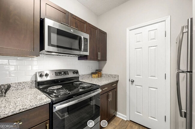 Building Photo - 7150 Peachtree Dunwoody Rd NE