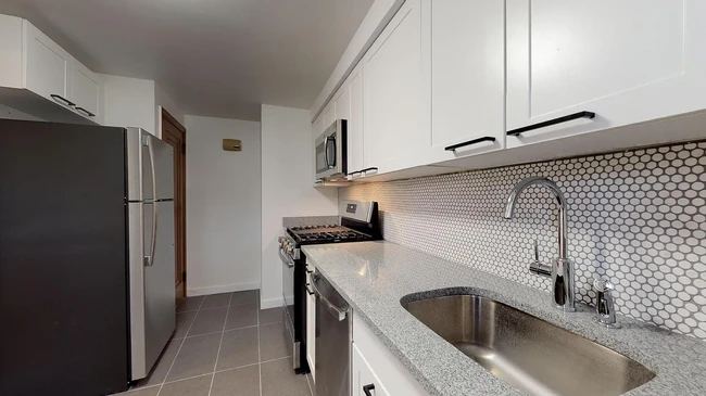 New modern white shaker cabinets and stylish porcelain tile flooring - 31 Marylea Ave