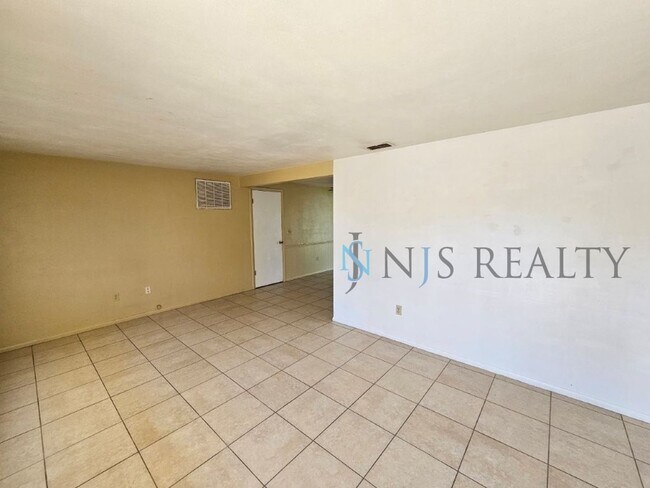 Building Photo - True 2/1.5/1 with FIREPLACE, fenced yard and all tile flooring throughout!
