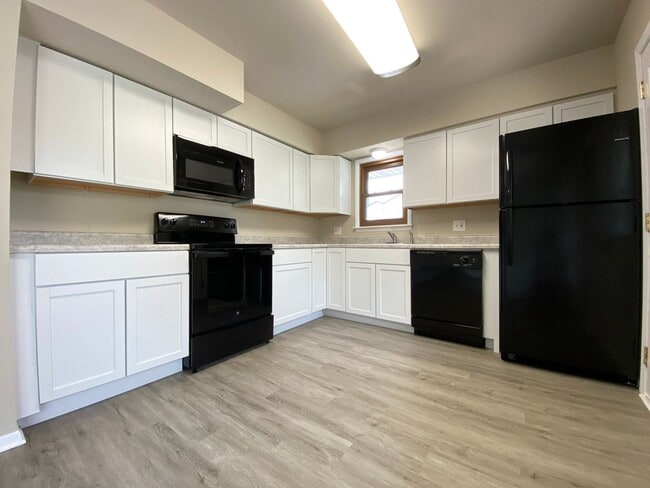 Building Photo - 3 Bedrooms 2 Full Bathrooms Finished Basem...