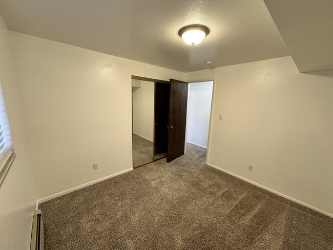 Building Photo - "Charming 3-Bedroom Condo with Hardwood Fl...