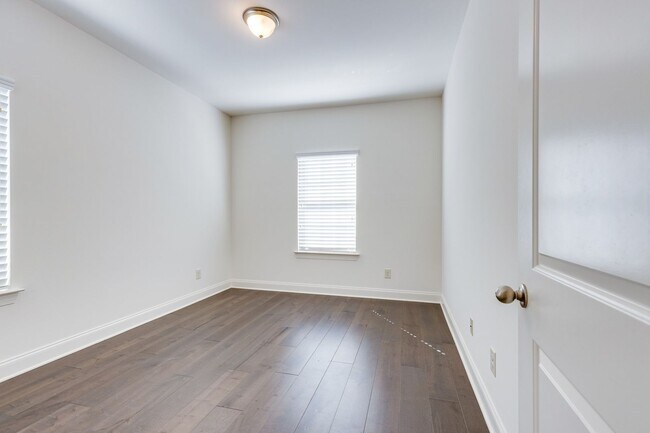 Building Photo - Welcome to this charming end unit townhome