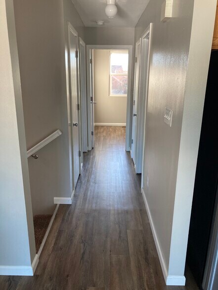 Upstairs hallway connecting upstairs living room to bedrooms - 1080 Fairlane Ct
