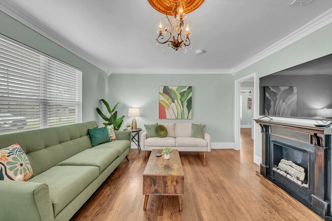 Large furnished living room with Smart TV, fast WiFi, and Samsung-ready setup. - 2301 North Dr