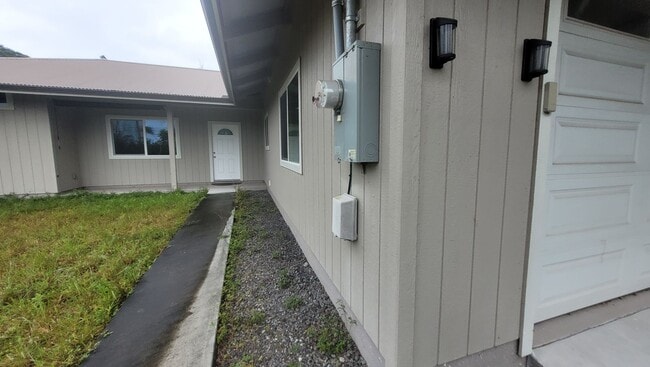 Building Photo - This 3-bedroom, 2-bath home in Orchidland Subdivision